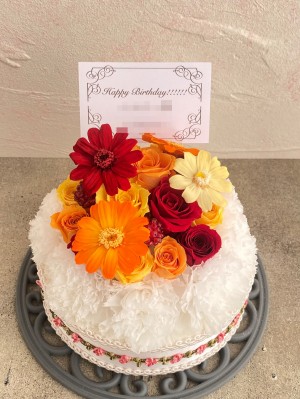 企業カラーをとりいれた誕生日祝いのフラワーケーキ